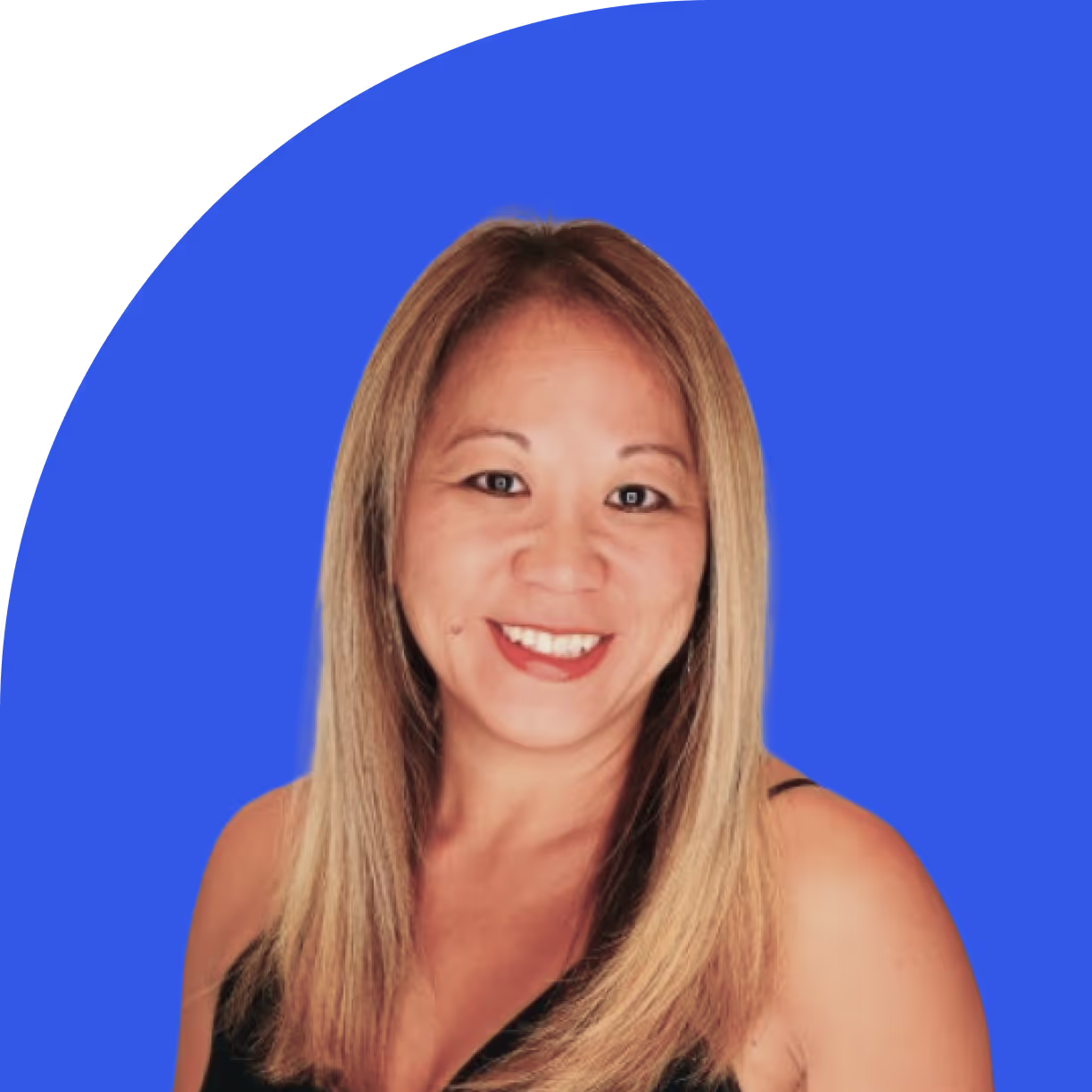 Smiling woman with long straight blonde hair, wearing a black sleeveless top, against a blue background with a curved border at the top left.